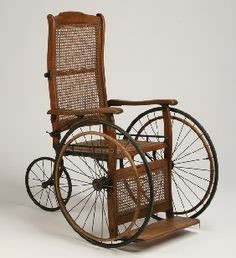 19th century wheelchair, made of wood and wicker.