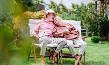 elderly-couple-sitting-in-the-garden